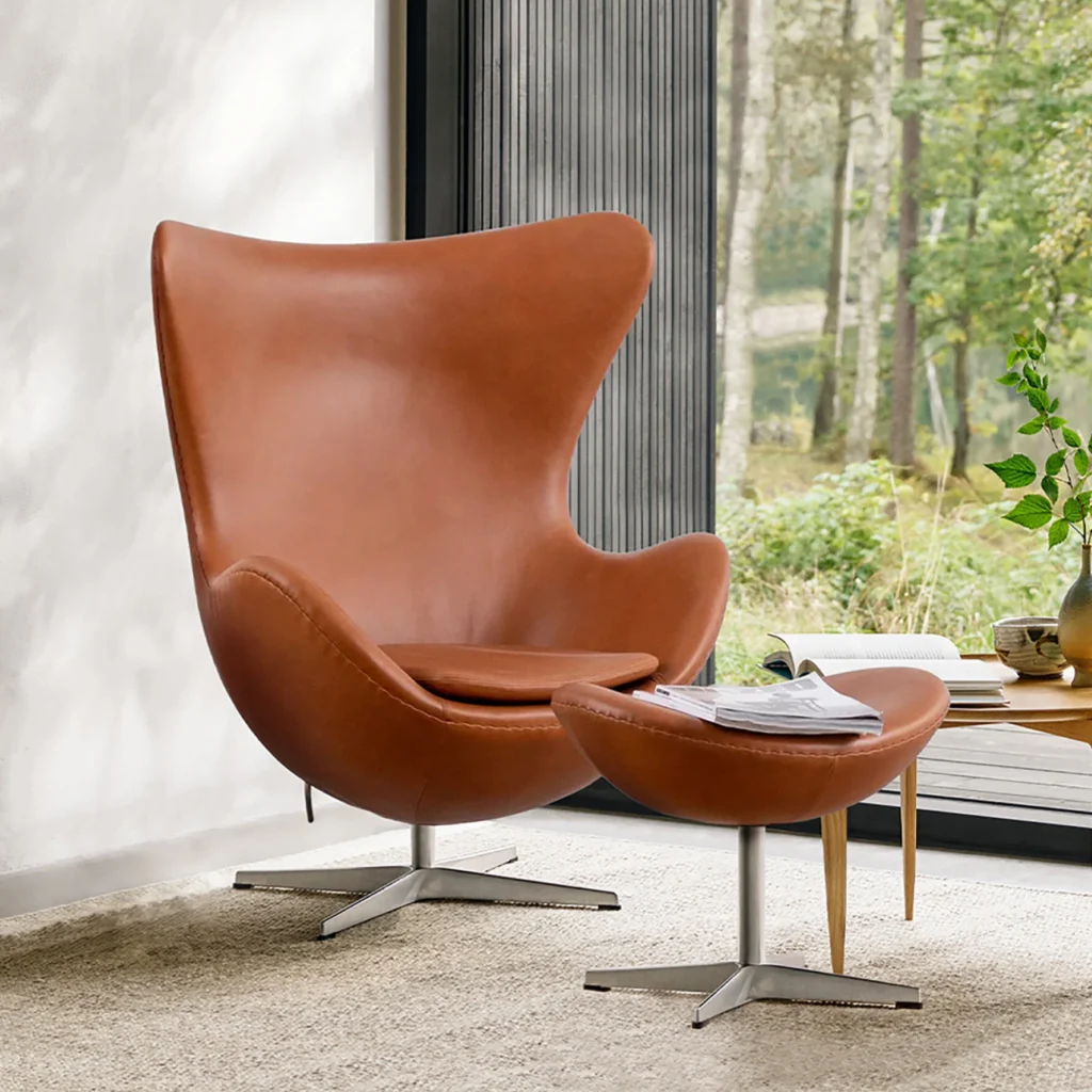 Sohnne Egg Chair Replica with matching stool in a modern design with smooth curves, perfect for living room or office spaces